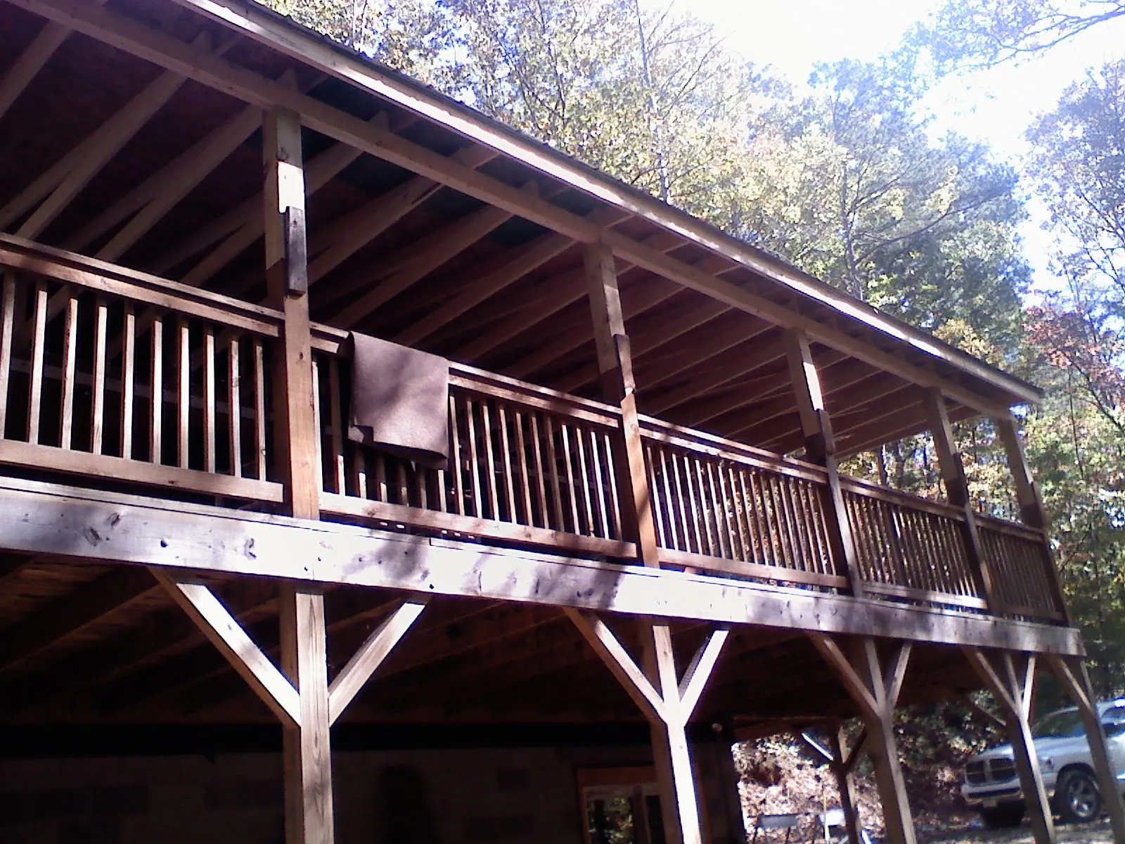 Timber framing under a new elevated porch and deck — Roof Leak Repair in Los Alamos by Roofing Brothers